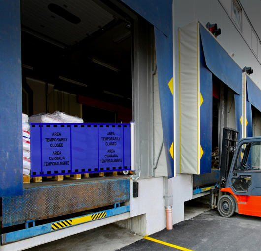 Portable barrier with printed warning signs