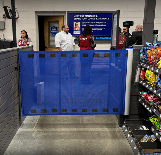 Portable industrial barrier with custom-printed shade